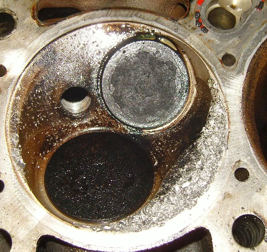 hole in piston and dinged up combustion chamber
